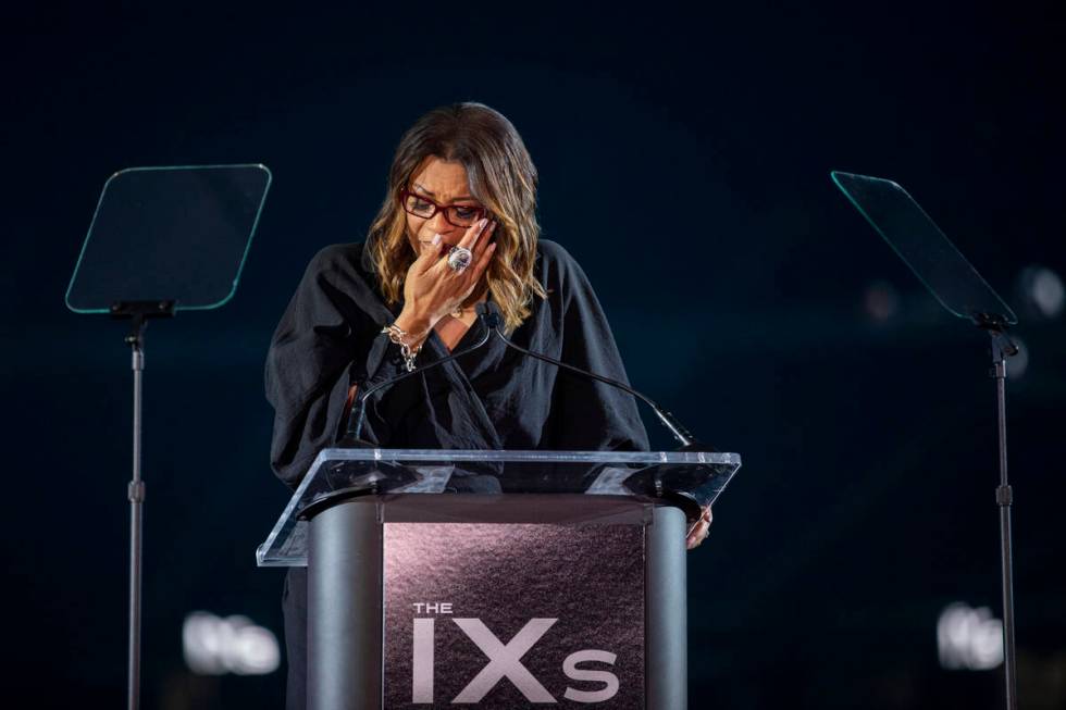 Nikki Fargas, President of the Las Vegas Aces, becomes emotional while speaking during The IX A ...
