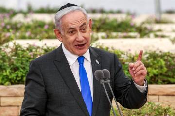 Israeli Prime Minister Benjamin Netanyahu speaks during a state memorial ceremony for the victi ...