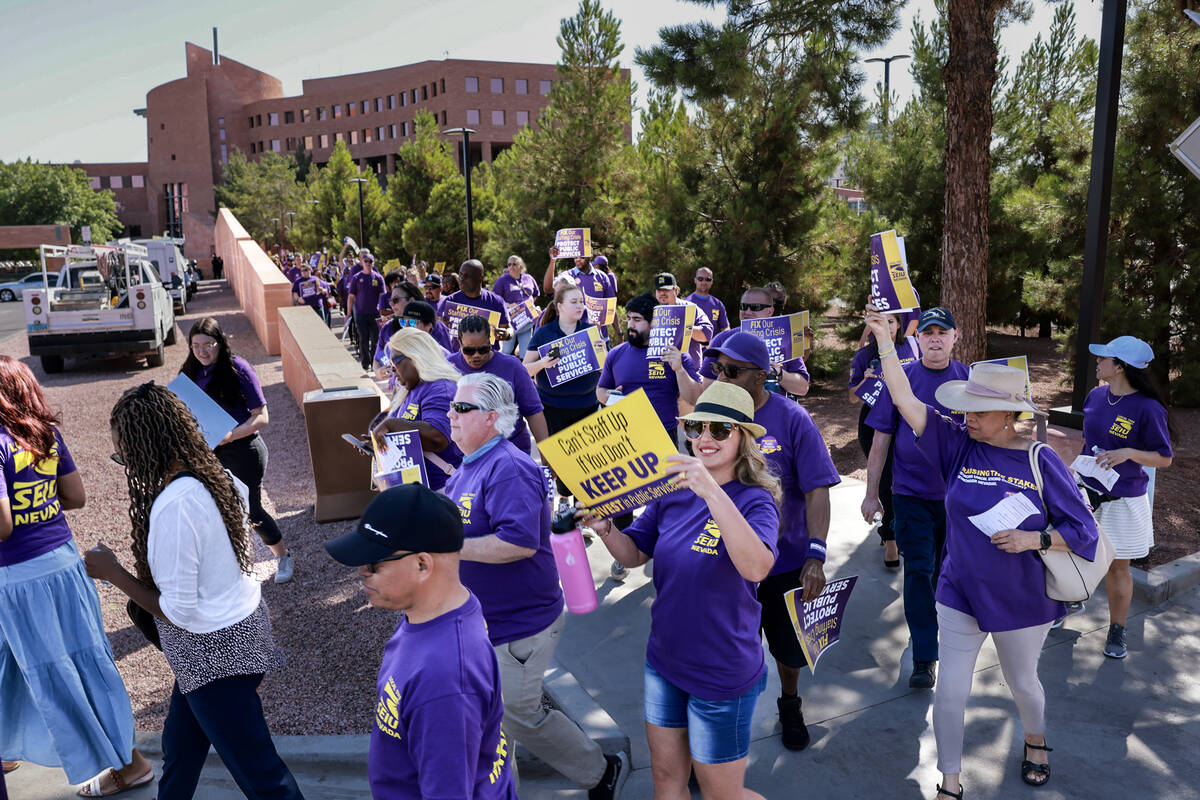 Clark County employees rally outside the Clark County Government Center in Las Vegas Tuesday, J ...