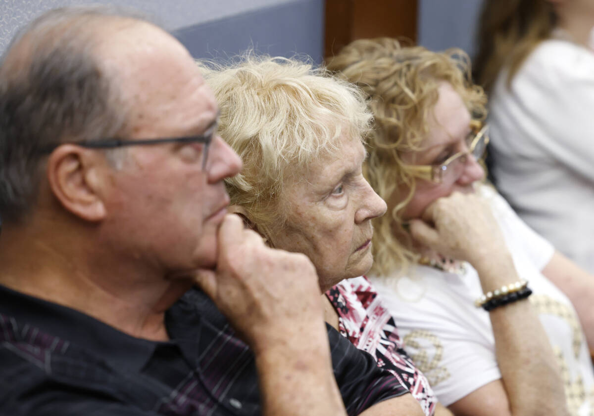 A family member, left, and friends of the shooting victim Sean Babbitt listen as Chief Deputy D ...