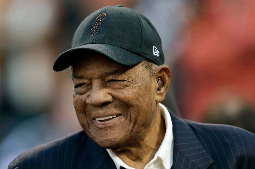 FILE - Baseball legend Willie Mays smiles prior to a game between the New York Mets and the San ...