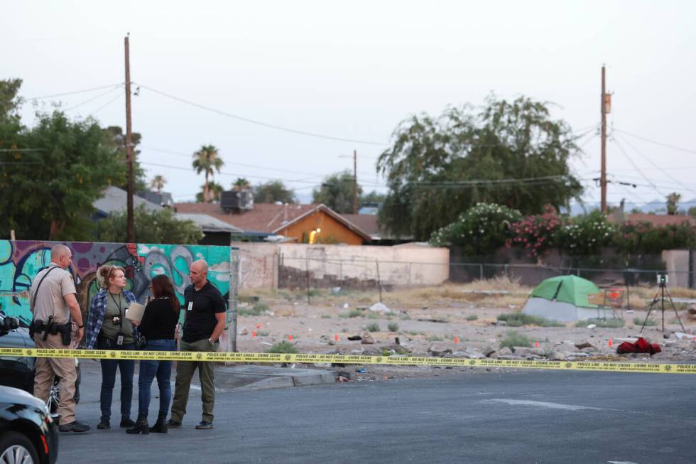 Metropolitan police investigate a homicide near the intersection of East Charleston Boulevard a ...