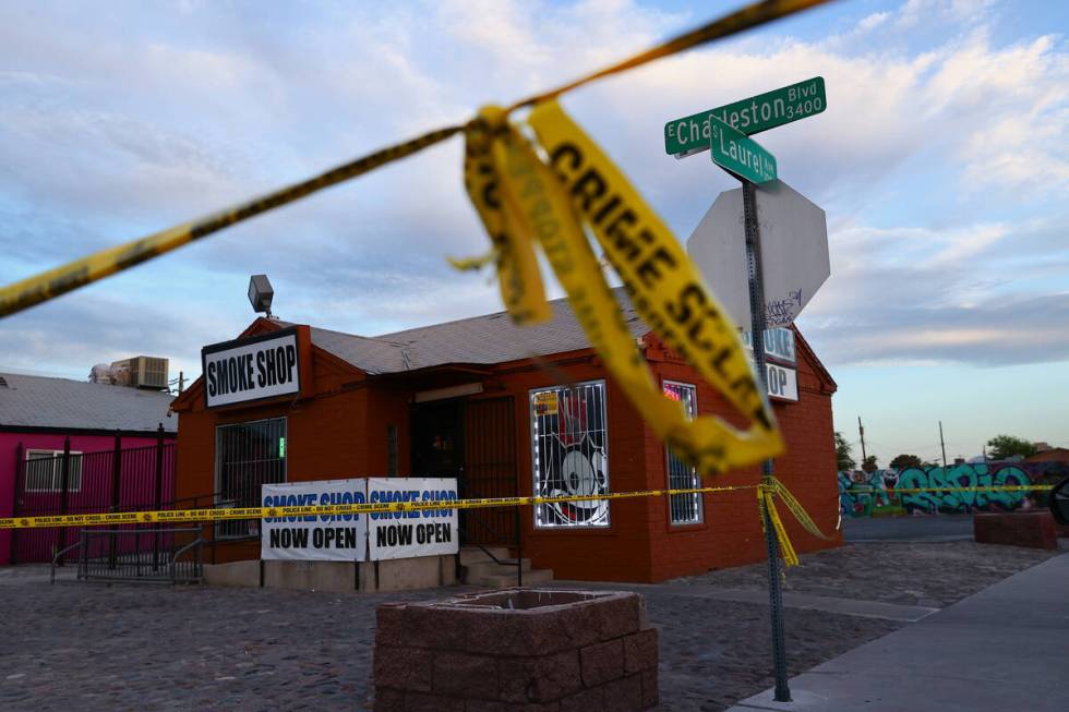 Crime scene tape surrounds the area where Metropolitan police are investigating a homicide near ...