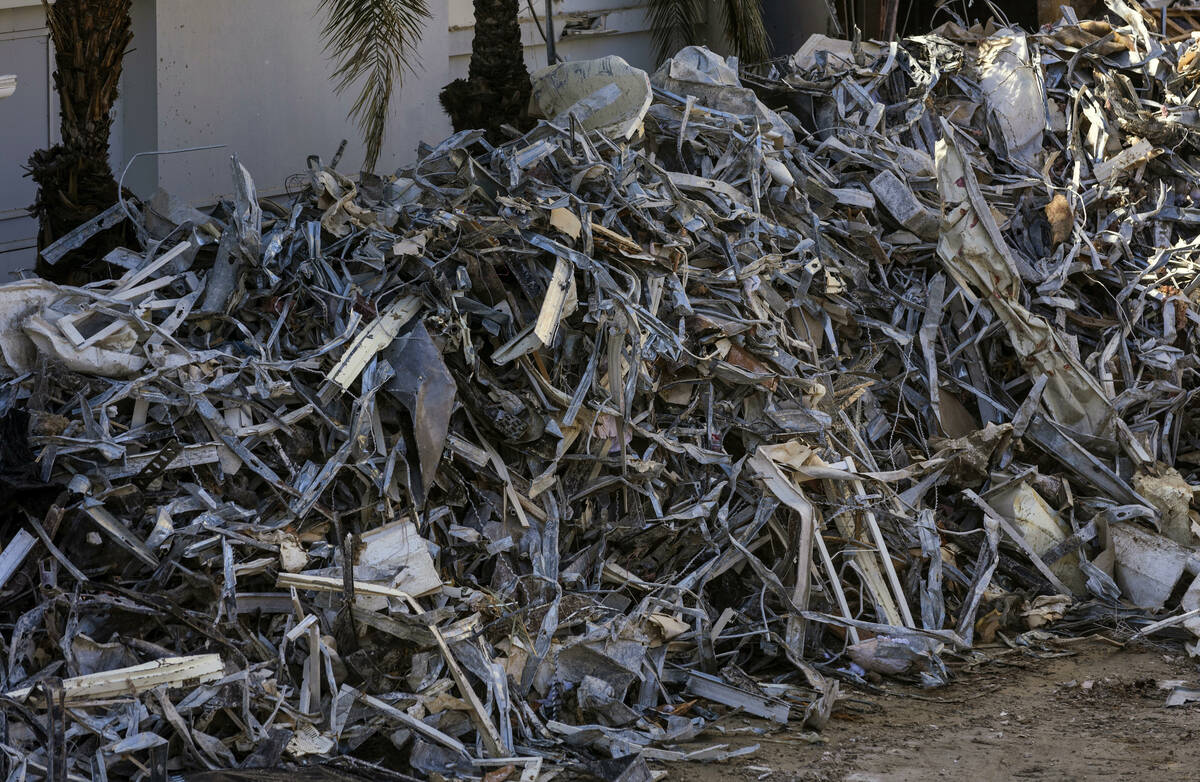 Scrap metal is piled up for transport near the former entrance as demolition continues on the T ...