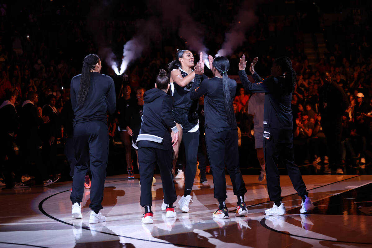 Las Vegas Aces center A'ja Wilson high fives her teammates before a WNBA basketball game agains ...