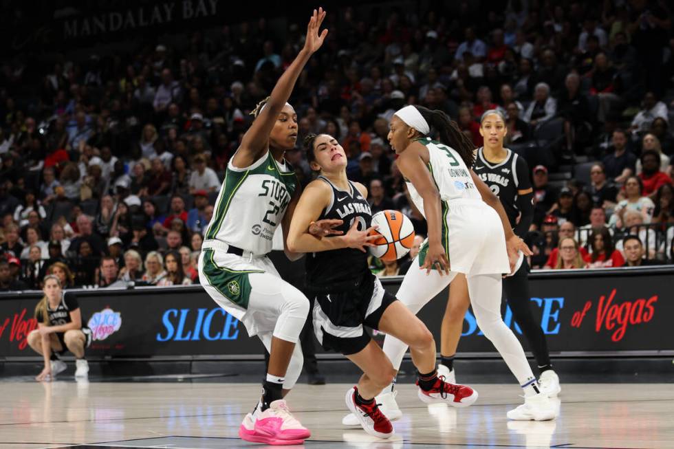 Las Vegas Aces guard Kelsey Plum (10) advances toward the hoop against Seattle Storm guard Jord ...