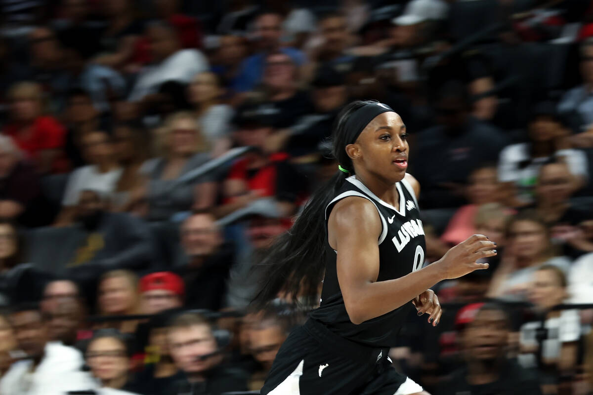 Las Vegas Aces guard Jackie Young (0) runs up the court during the second half of a WNBA basket ...