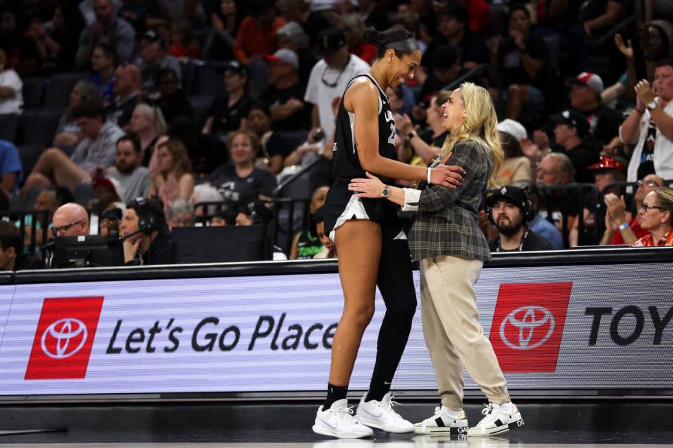 Las Vegas Aces center A'ja Wilson and head coach Becky Hammon embrace during the final minutes ...