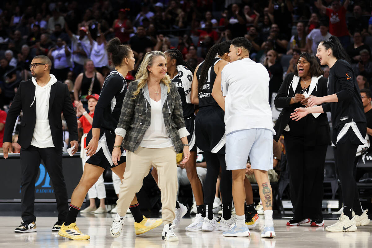The Las Vegas Aces celebrate a significant lead on the Seattle Storm as they begin a time out d ...