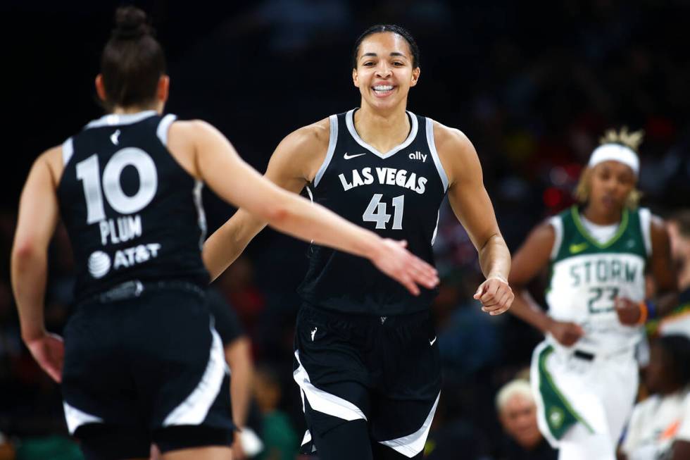 Las Vegas Aces center Kiah Stokes (41) celebrates with guard Kelsey Plum (10) after scoring a t ...