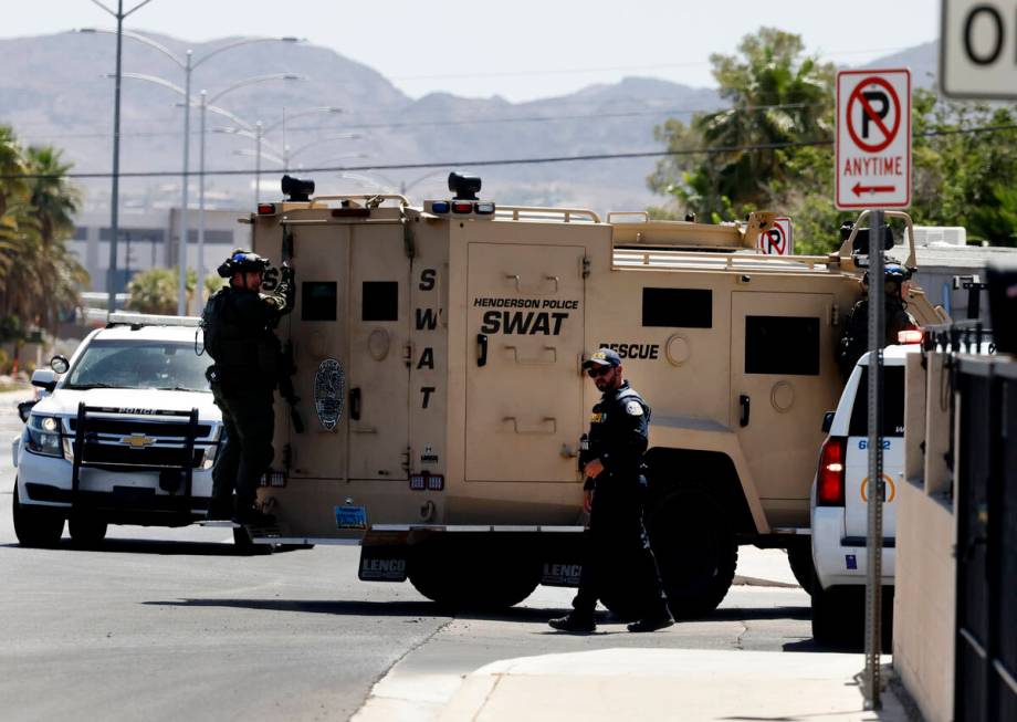 The Henderson Police Department SWAT team officers arrive where a shooting that involved police ...