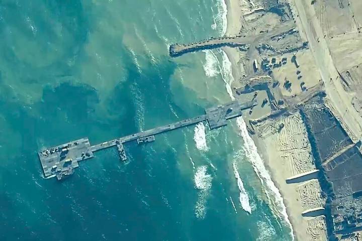 FILE - This image provided by U.S. Central Command, shows the U.S.-built floating pier being us ...