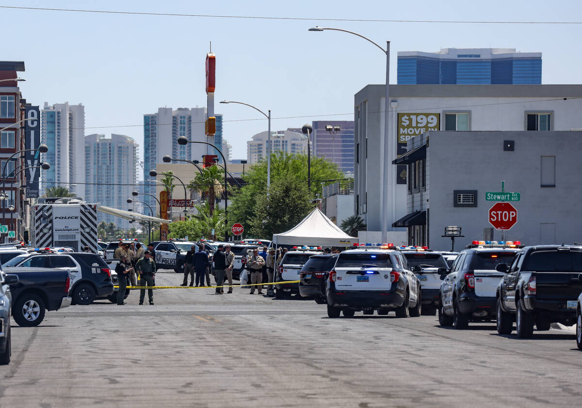 Police at the scene of an officer-involved shooting on 9th Street in Downtown Las Vegas, Thursd ...