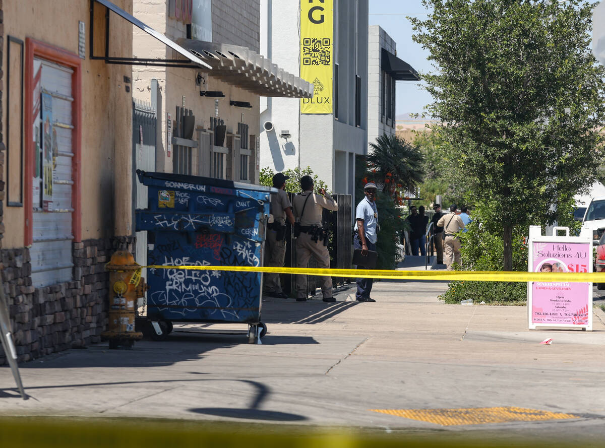 Police near the scene of an officer-involved shooting on 9th Street in Downtown Las Vegas, Thur ...
