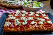 A Sicilian pepperoni with ricotta cheese pizza from Good Pie in the Arts District is seen on Fr ...