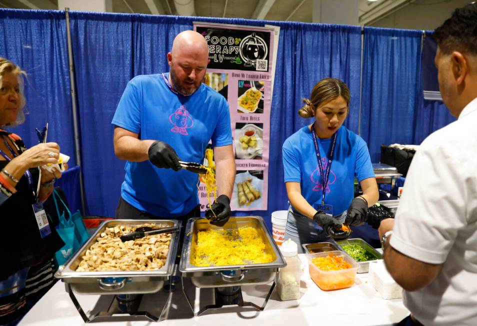 Judy Le, right, owner of Food Therapy LV, and her partner Stephen Allen serve sample of Asian f ...
