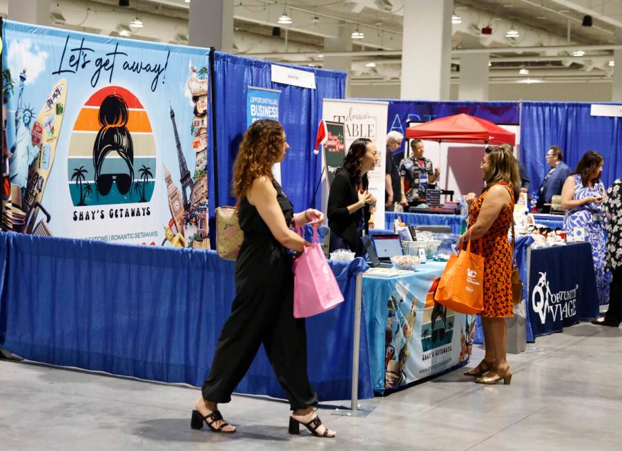 Expogoers check out booths at The Expo at World Market Center during a small business expo, Wed ...