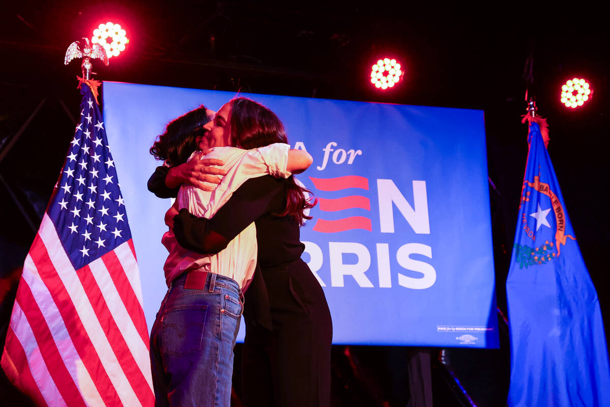 Rep. Alexandria Ocasio-Cortez, D-N.Y., right, hugs Alexis Gonzalez-Black after she shared her a ...