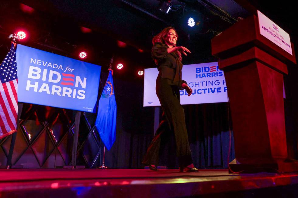 Rep. Alexandria Ocasio-Cortez, D-N.Y., takes the stage to speak during a rally for the Biden-Ha ...