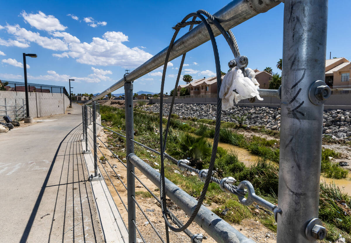 Cable is wrapped about a fence line near where Angel Naranjo died after he struck a cable stret ...