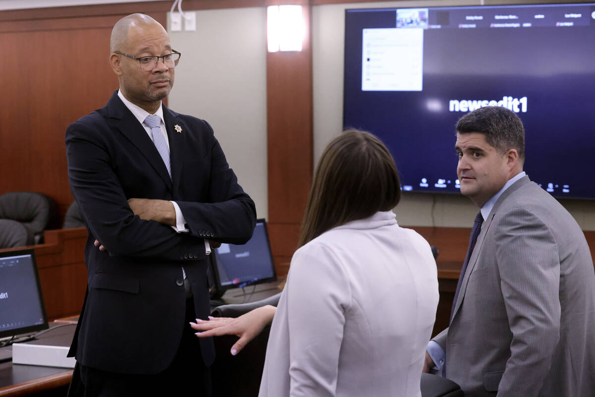 Attorney General Aaron Ford, left, meets with Chief Deputy Attorney General Alissa Engler, and ...