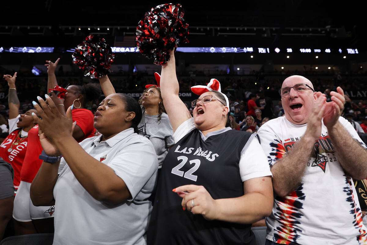 Las Vegas Aces fans cheer during the first half of a WNBA basketball game against the Connectic ...