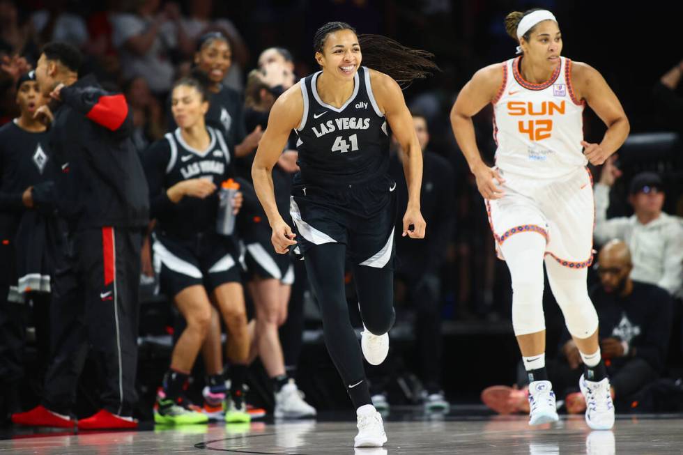 Las Vegas Aces center Kiah Stokes (41) reacts after scoring a three-point basket while Connecti ...