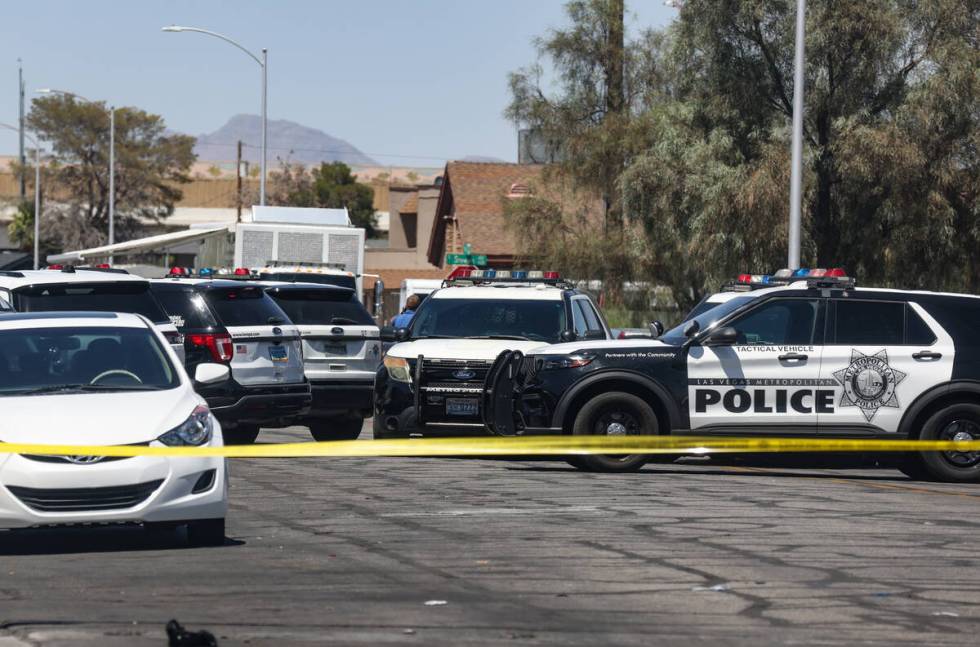 Police near the scene of an officer-involved shooting on 9th Street in Downtown Las Vegas, Thur ...