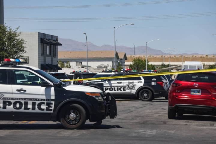 Police near the scene of an officer-involved shooting on 9th Street in Downtown Las Vegas, Thur ...