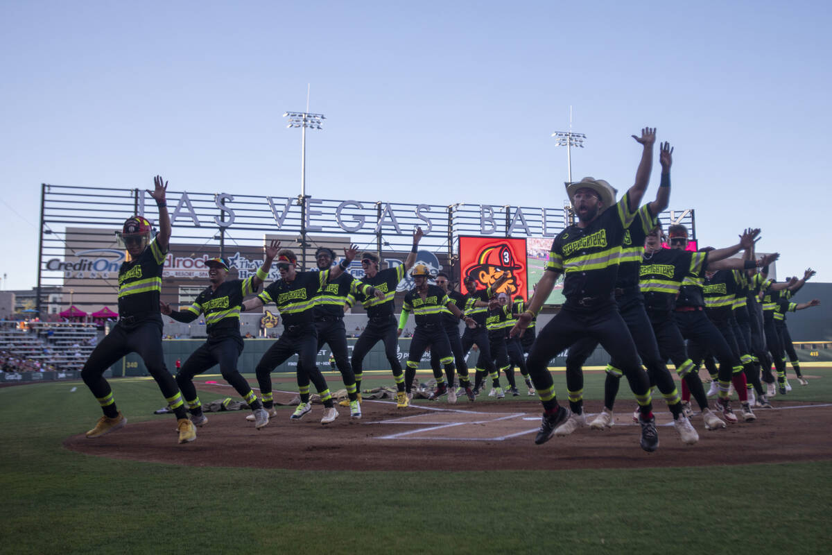 The Firefighters dance after their lineup is announced before the game against the Party Animal ...