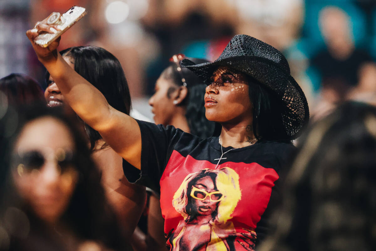 A fan takes a selfie before Megan Thee Stallion takes the stage during the Hot girl Summer Tour ...