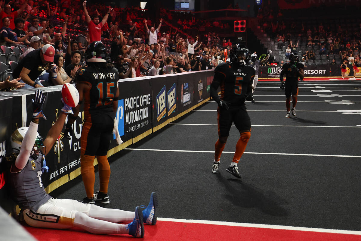 Vegas Knight Hawks wide receiver CJ Windham (7) holds the ball up after scoring a touchdown dur ...