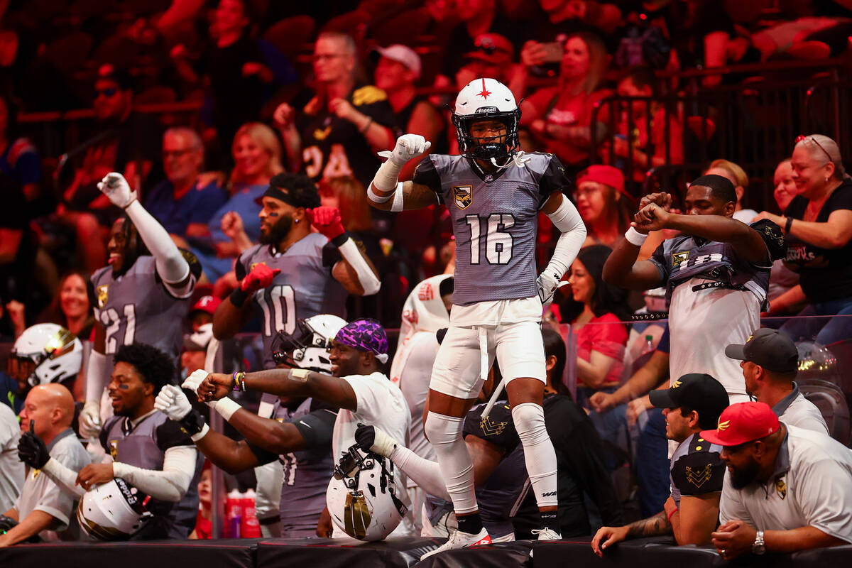 Vegas Knight Hawks defensive back Jericho Flowers (16) and the bench dance as their team is win ...