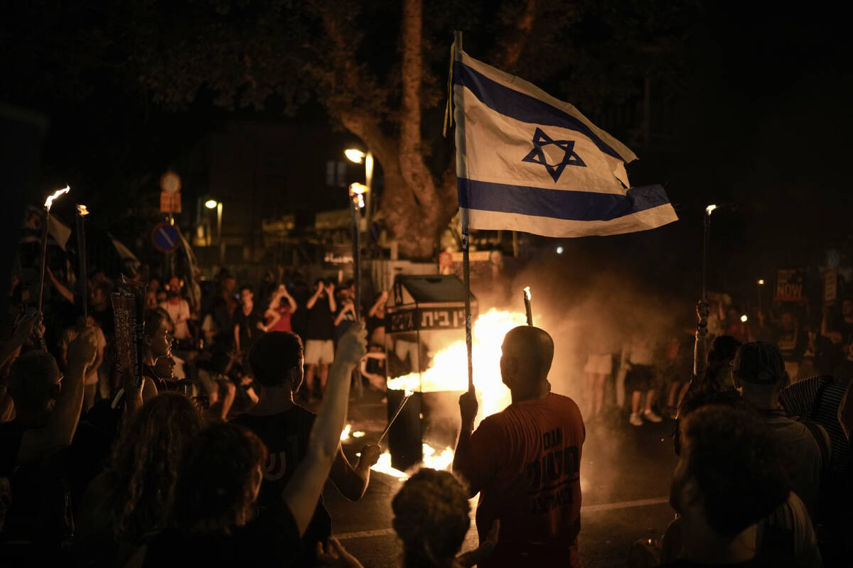 People protest against Israeli Prime Minister Benjamin Netanyahu's government and call for the ...