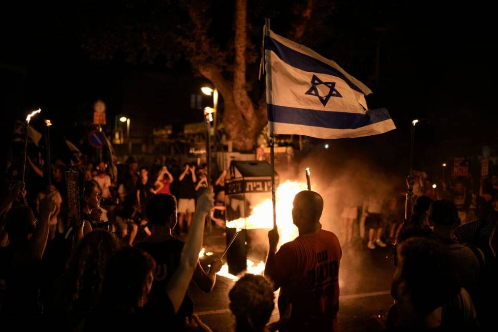 People protest against Israeli Prime Minister Benjamin Netanyahu's government and call for the ...