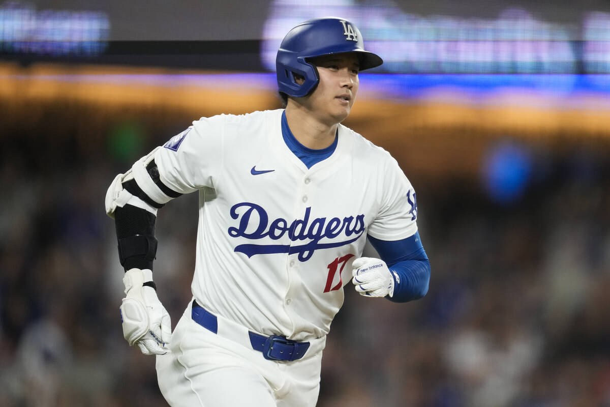 Los Angeles Dodgers designated hitter Shohei Ohtani runs the bases after hitting a home run dur ...