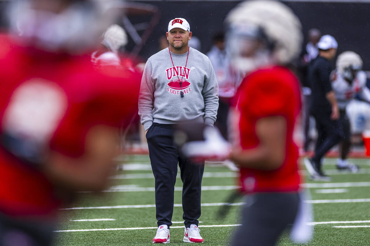 UNLV head coach Barry Odom observes his players during spring football practice at the Fertitta ...