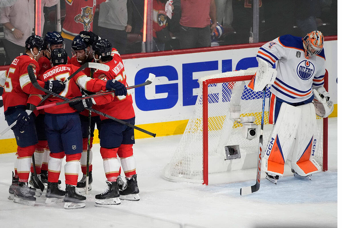Florida Panthers teammates celebrate with Carter Verhaeghe (23) after he scored a goal during t ...
