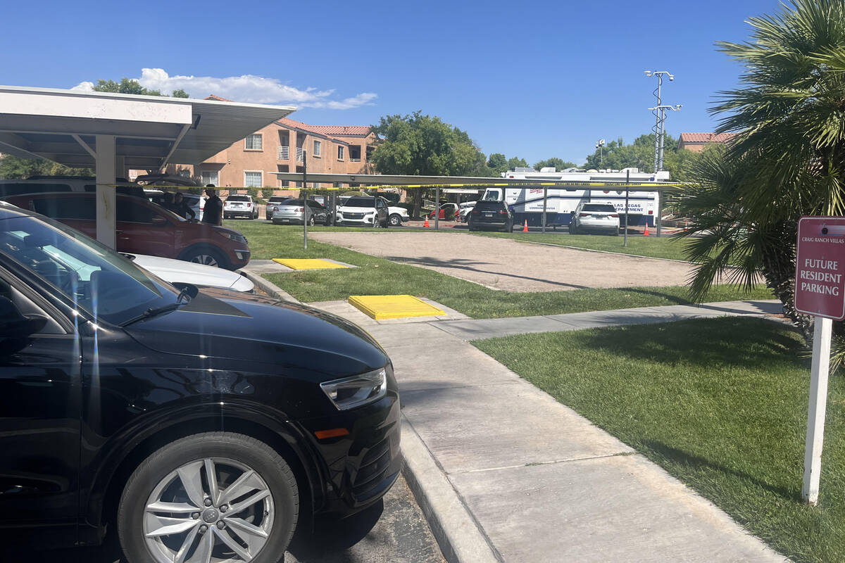 Police investigate the scene of a fatal shooting at an apartment complex on Casa Norte Drive on ...