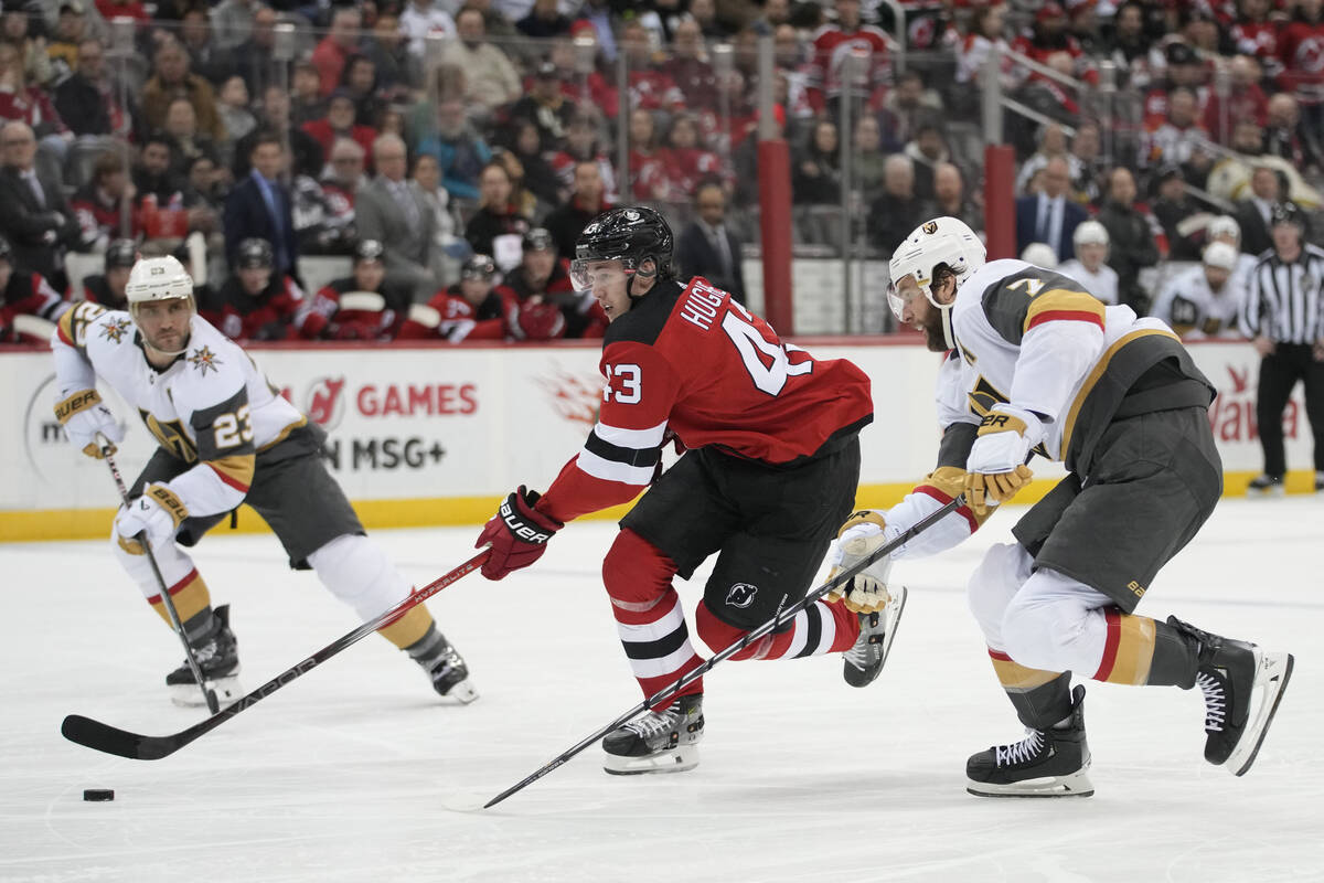 New Jersey Devils defenseman Luke Hughes (43) skates against Vegas Golden Knights defenseman Al ...