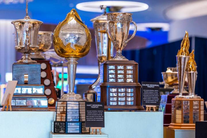 The Hart Memorial Trophy, left center, is one the 18 NHL trophies on display as the awards even ...