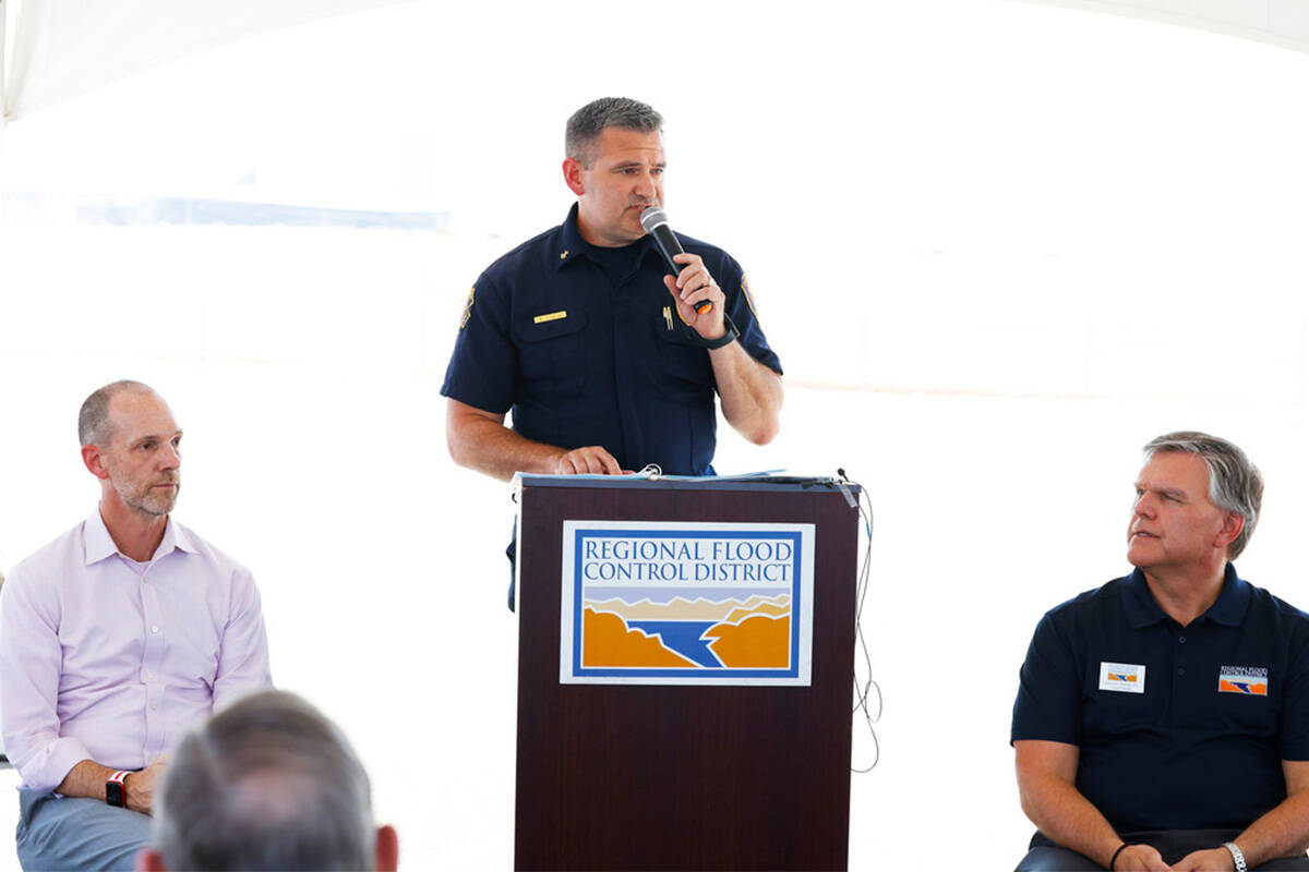 Brian O'Neal, assistant fire chief of the Clark County Fire Department, speaks as Justin Jones, ...