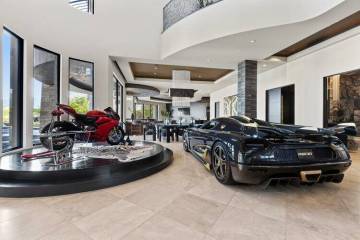 The house features a door that allows the owner to drive cars into the living room. (Photo: Mic ...