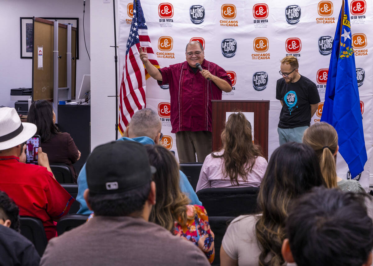 Joseph Garcia, left, adds one more point while speaking beside Rudy Zamora during the 2024 Lat ...