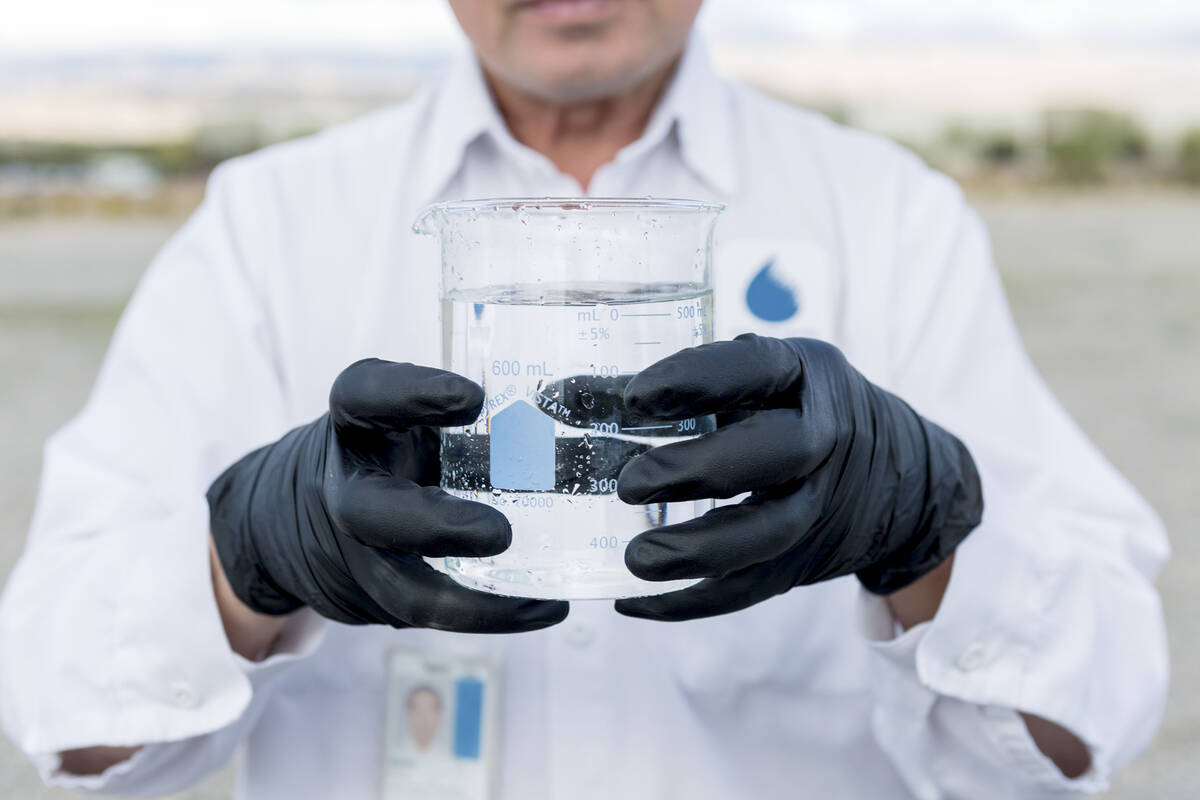 Water Quality Monitoring Field Specialist Daniel Luong tests water samples from the Montessori ...