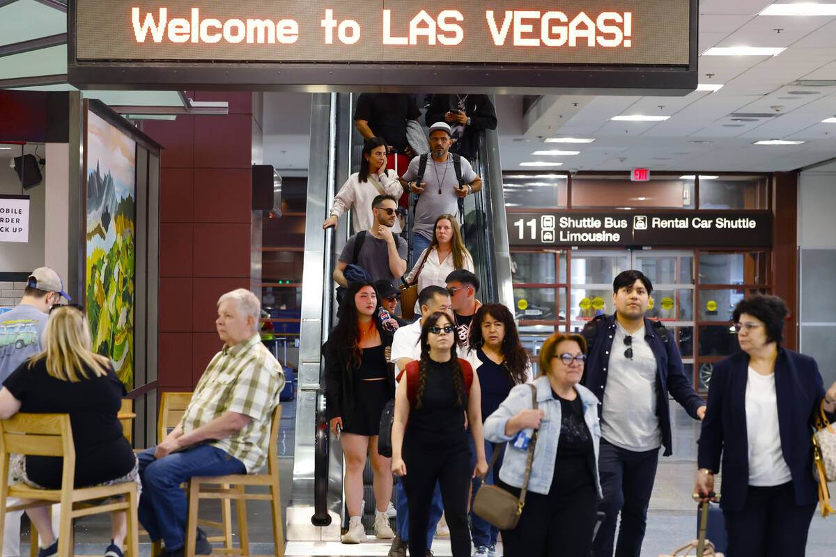 Passengers arrive at Terminal-1 of Harry Reid International Airport on Friday, May 24, 2024, in ...