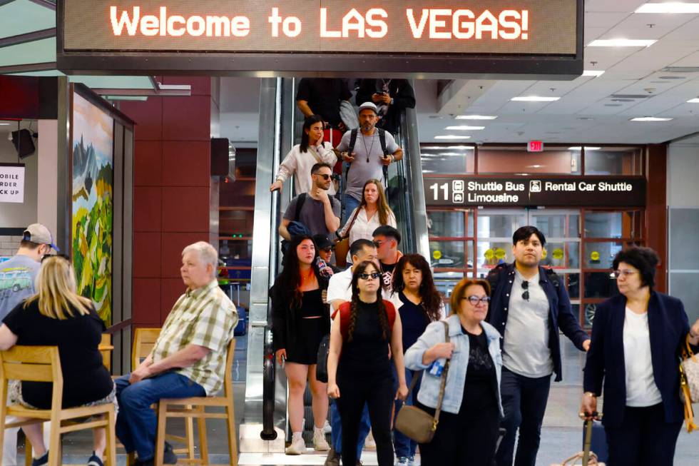 Passengers arrive at Terminal-1 of Harry Reid International Airport on Friday, May 24, 2024, in ...