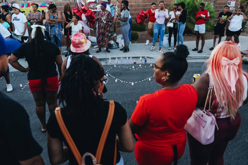 Mourners gather during a vigil for Kayla Harris, who was killed in a quintuple homicide on June ...