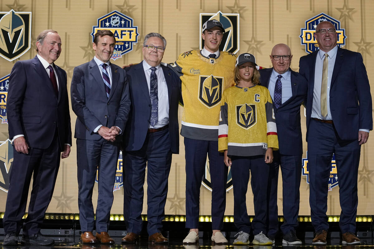David Edstrom, center, poses with Vegas Golden Knights officials after being picked by the team ...