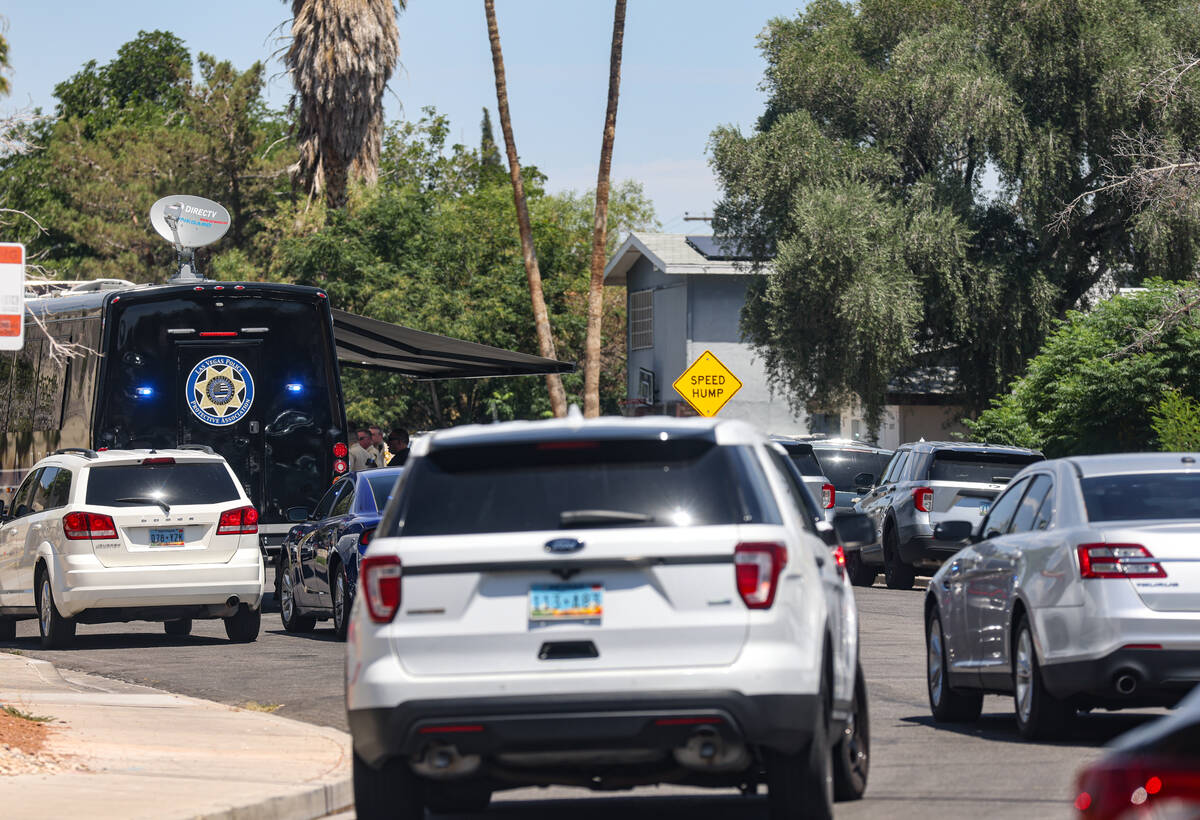 Las Vegas police investigate the scene of an officer-involved shooting in the 2000 block of Val ...